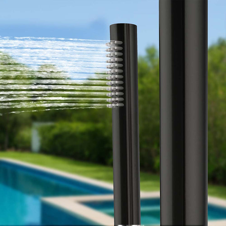 Black stainless steel outdoor shower handheld spray in use