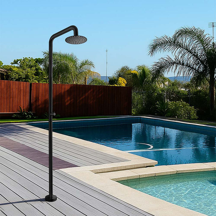 Stainless steel outdoor shower in black finish by poolside