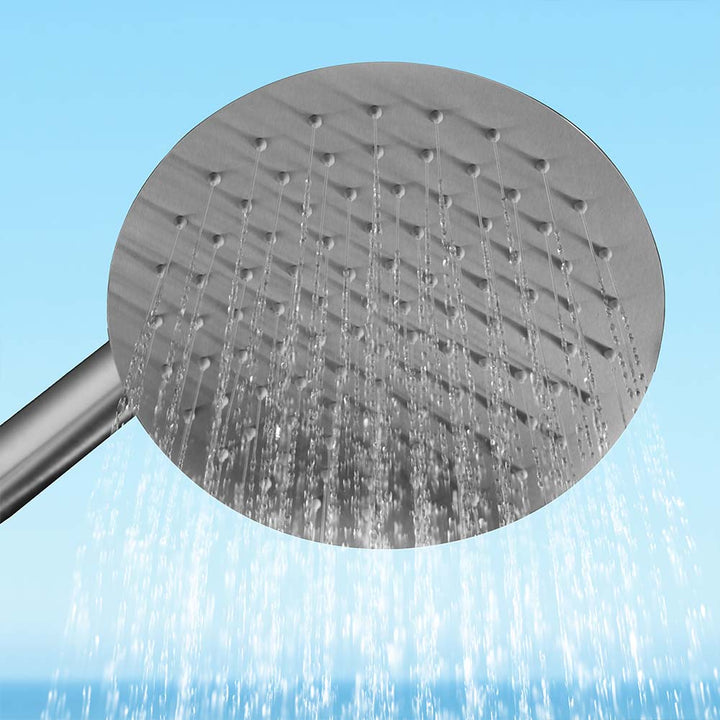 Stainless steel outdoor shower head upward view with water flow
