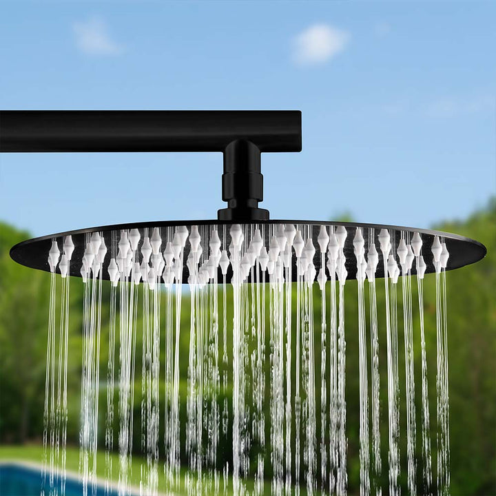 Close-up of the water flowing from the stainless steel outdoor shower head