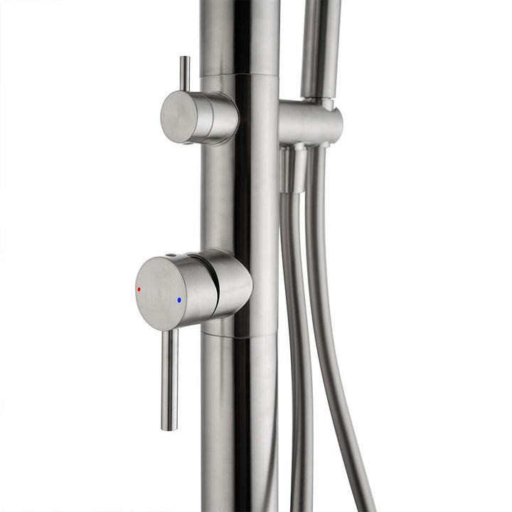 Close-up of temperature control handle on stainless steel outdoor shower with red and blue indicators