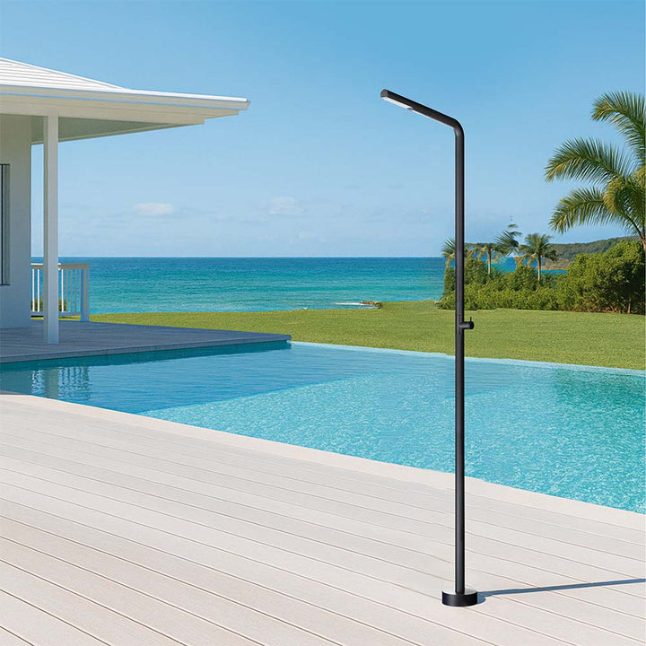 Outdoor stainless steel shower by poolside with ocean view
