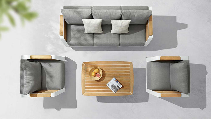 Top view of modern aluminum and wood outdoor sofa set with gray cushions and coffee table