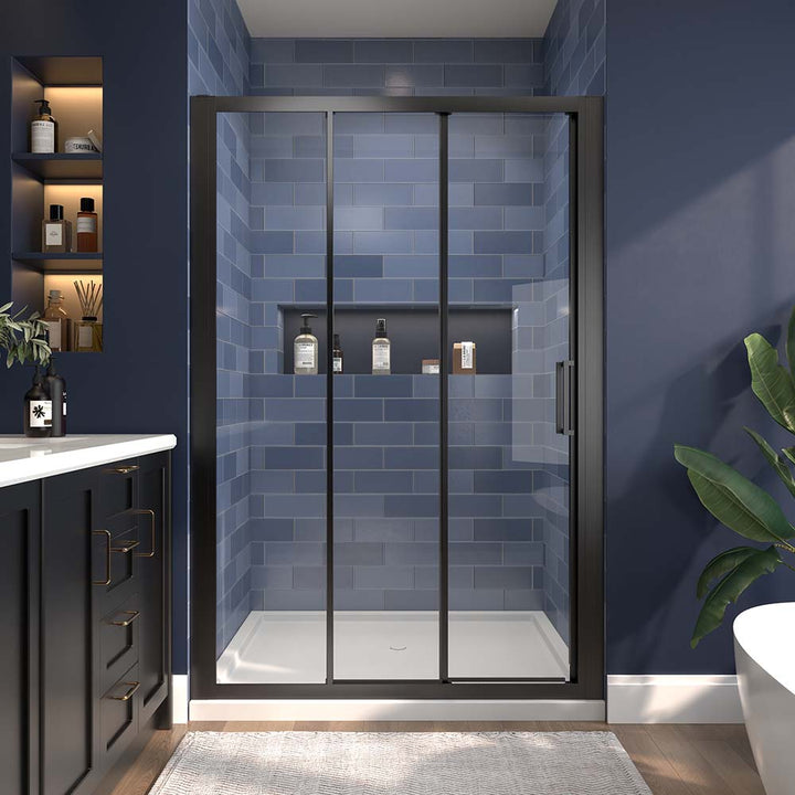 Tri fold shower door black frame front view with blue tile wall