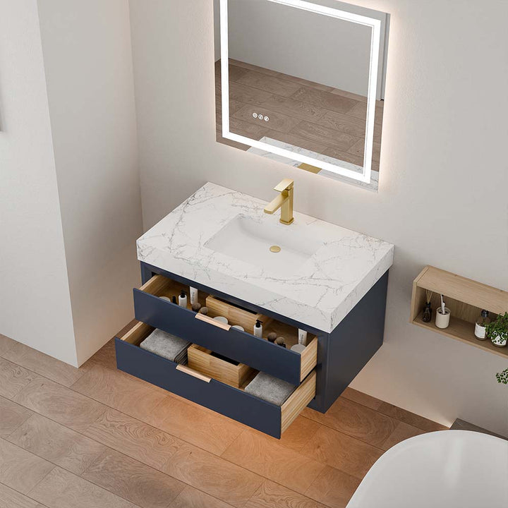 Blue wall mounted bathroom vanity with open drawers and marble top