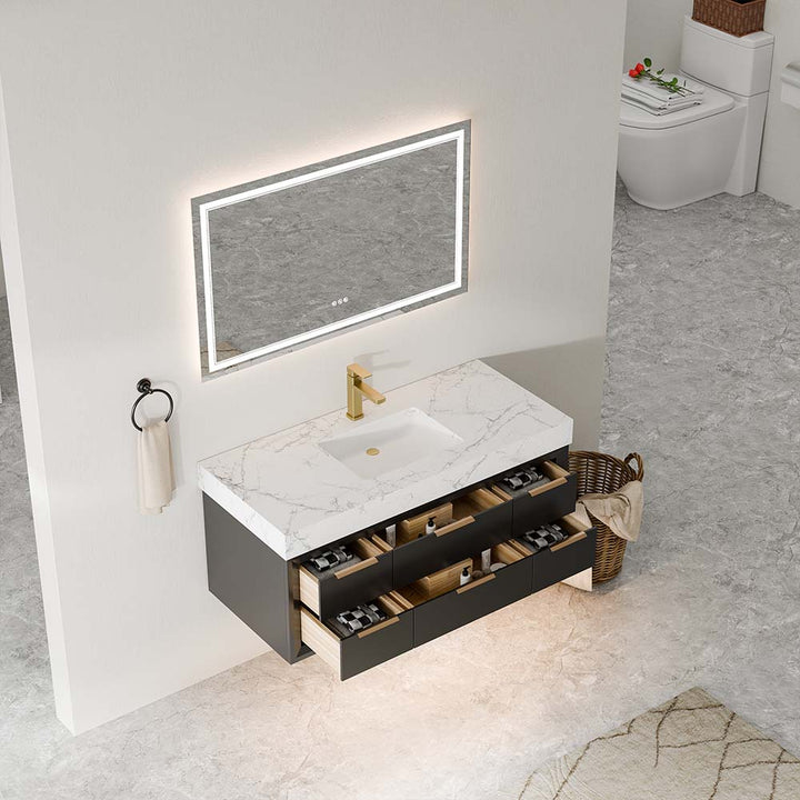 Top view of bathroom vanity with LED mirror and open drawers