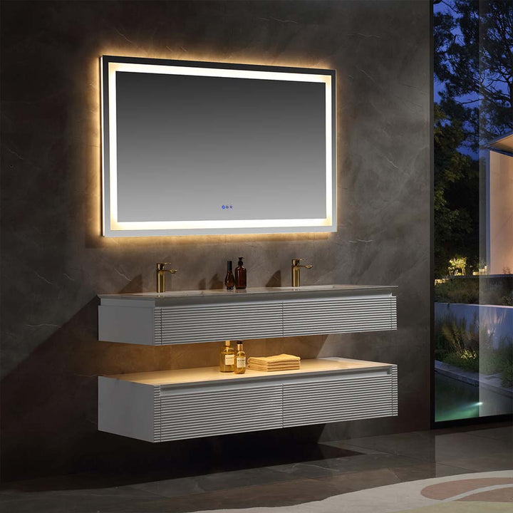 White wall mounted bathroom vanity with LED mirror and ambient lighting