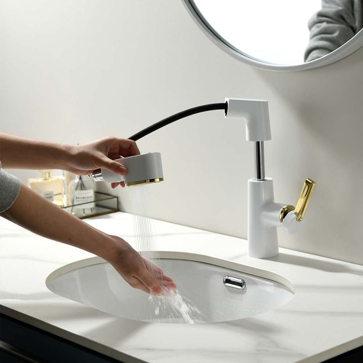 White and gold bathroom faucet with detachable hose and water flow