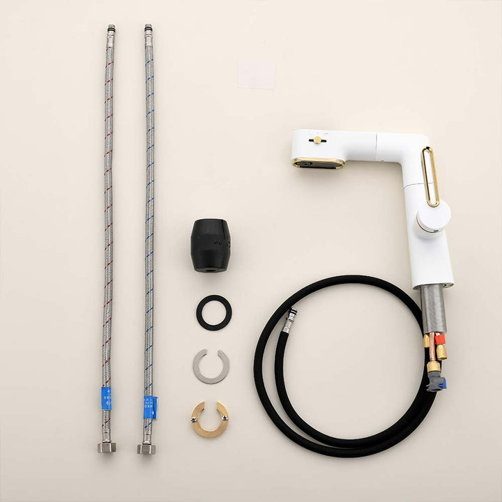 White and gold bathroom faucet parts with braided hoses and accessories