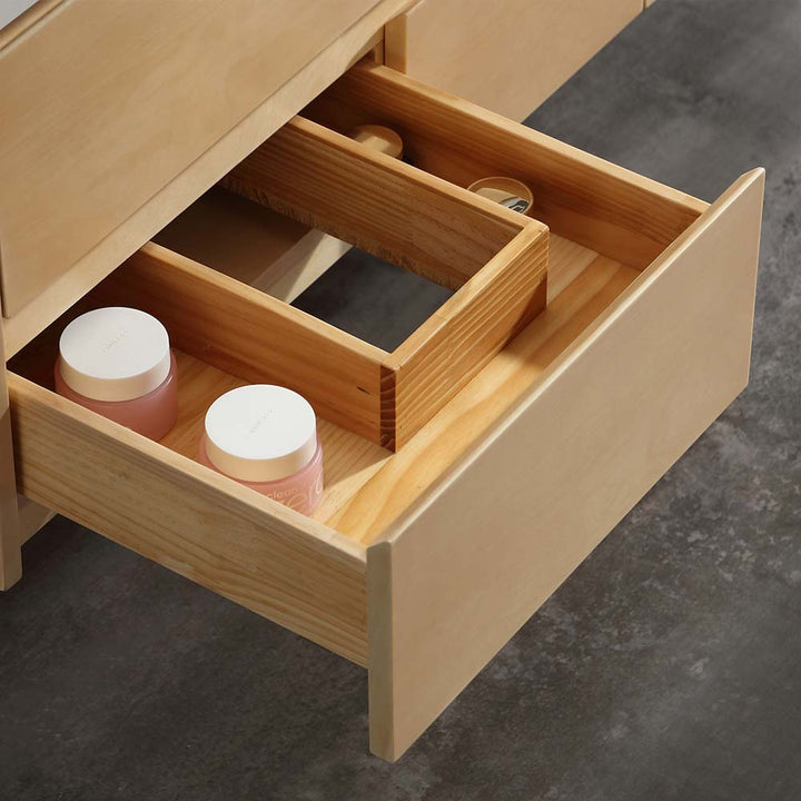 Wooden storage divider in drawer of marble vanity for organization