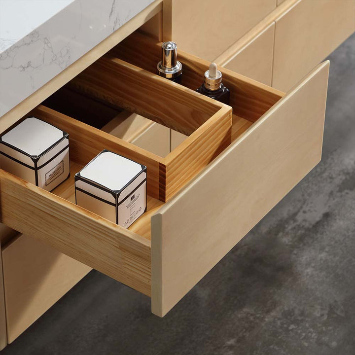 Organized drawer with wooden storage divider in marble vanity